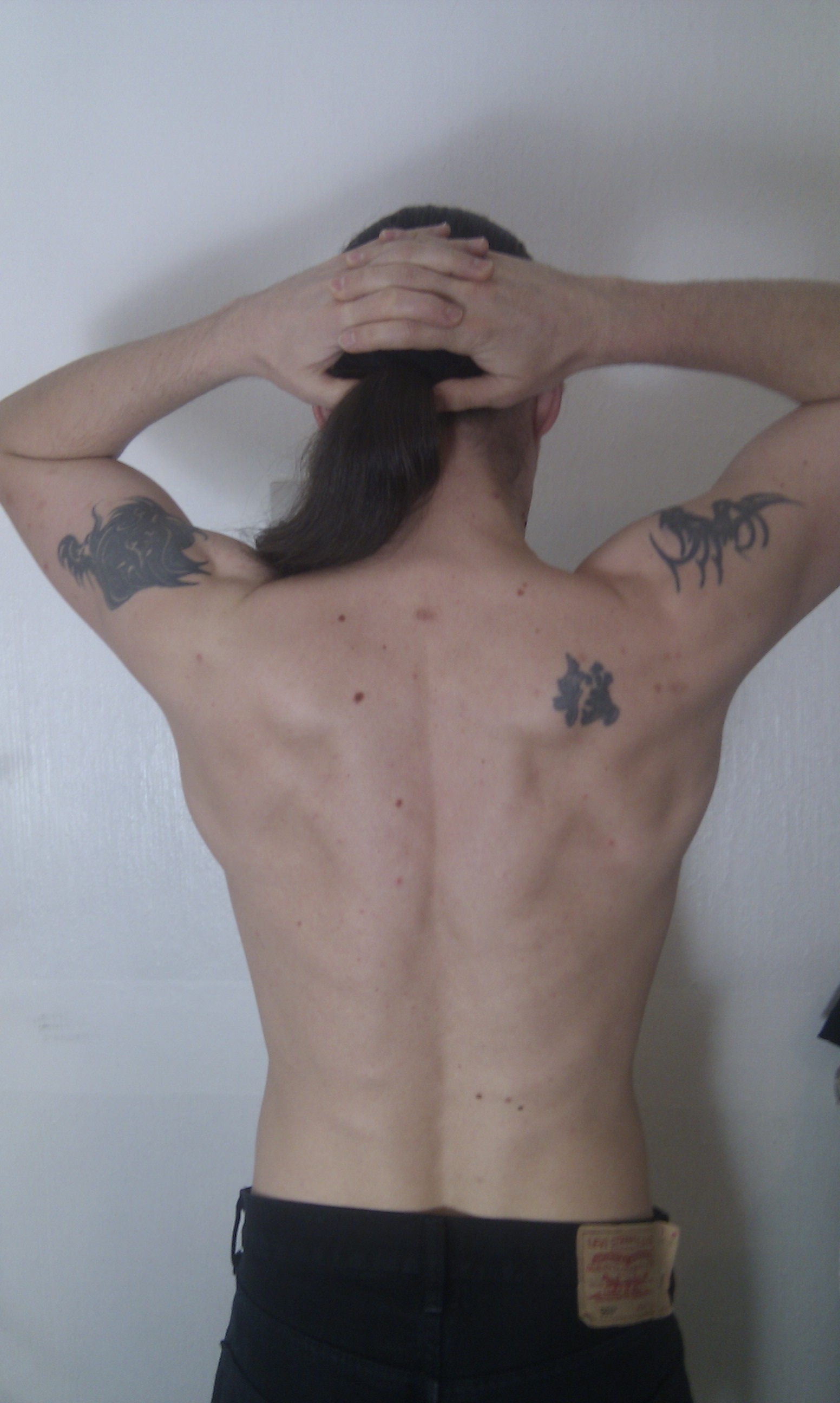 Back, tensed, with arms up